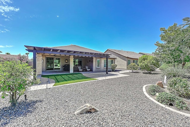 back of property with a patio and a pergola