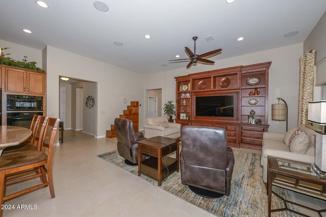 tiled living room with ceiling fan