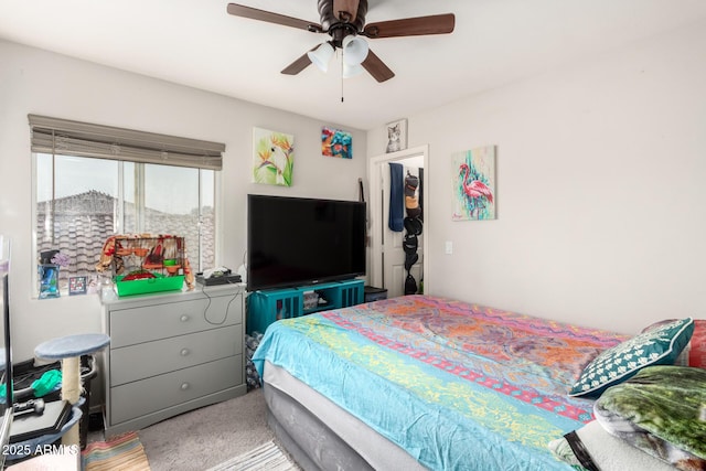 carpeted bedroom with a ceiling fan