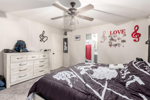 carpeted bedroom featuring connected bathroom and ceiling fan