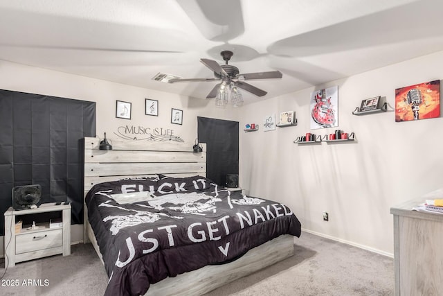 carpeted bedroom featuring visible vents, baseboards, and a ceiling fan