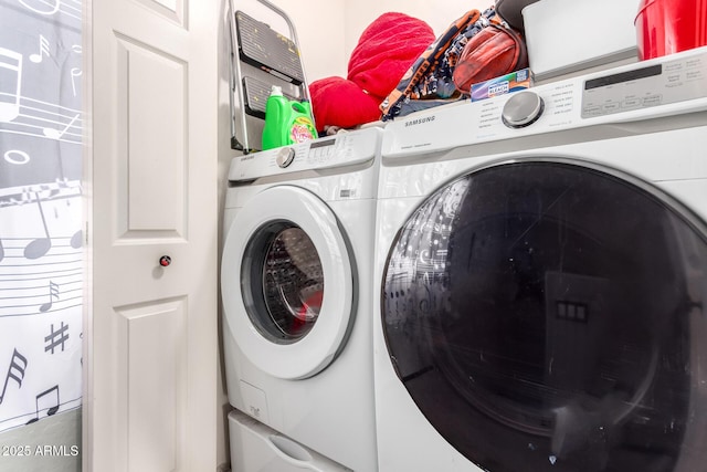 laundry room featuring washer and dryer and laundry area