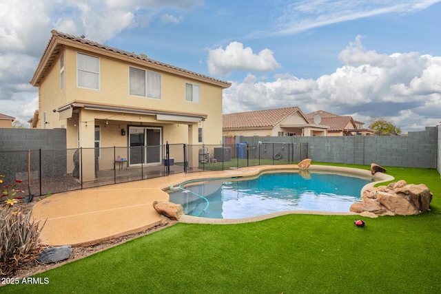 view of pool with a yard, a fenced in pool, a fenced backyard, and a patio area