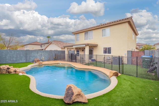 view of swimming pool with a lawn, a patio, a fenced backyard, and a fenced in pool