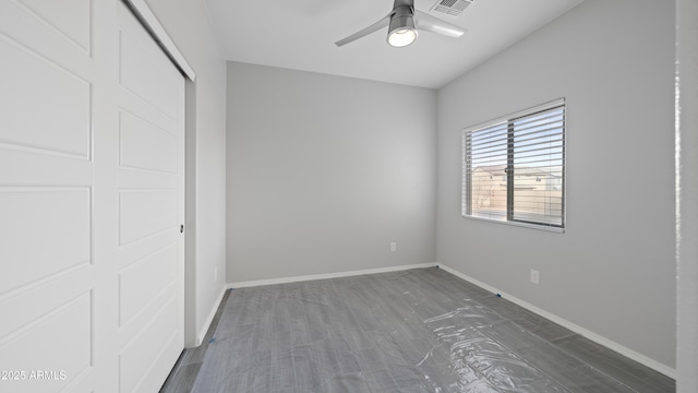 unfurnished bedroom with baseboards, visible vents, a closet, and a ceiling fan