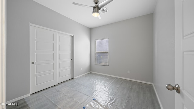 unfurnished bedroom featuring baseboards, visible vents, a closet, and a ceiling fan