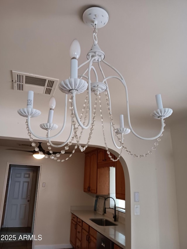 details with sink, a notable chandelier, and dishwashing machine