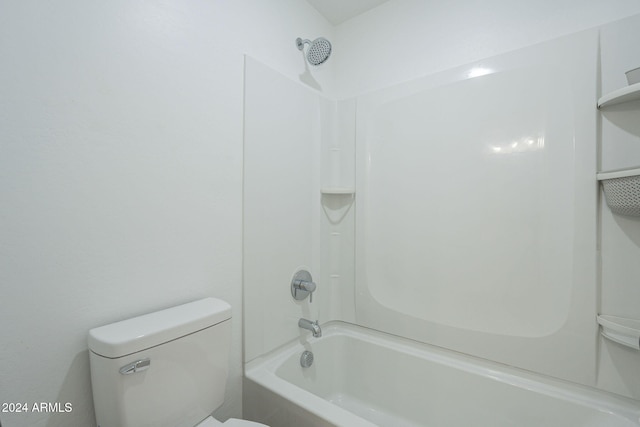 bathroom with shower / bath combination and toilet