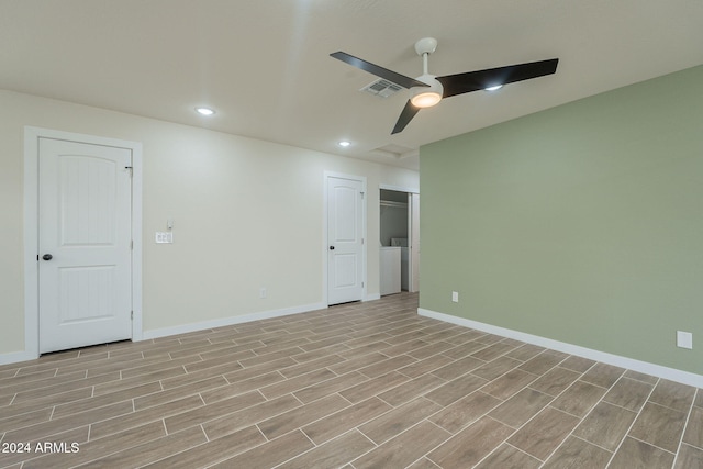 unfurnished room with light hardwood / wood-style floors, washer / clothes dryer, and ceiling fan