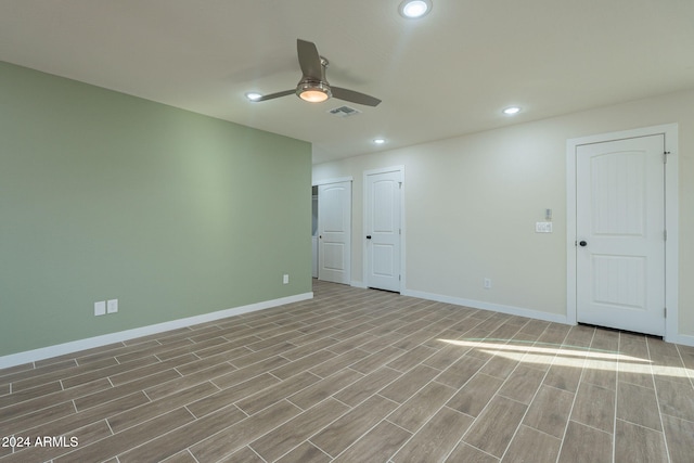 empty room featuring light hardwood / wood-style floors and ceiling fan