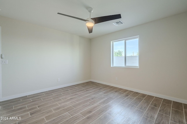 empty room featuring ceiling fan and light wood-type flooring