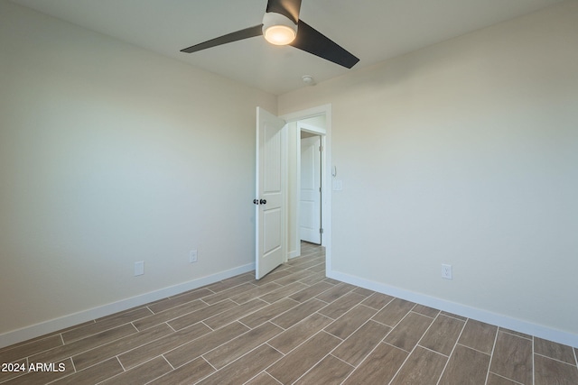 spare room with ceiling fan and light hardwood / wood-style floors