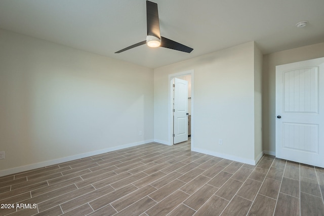 spare room with ceiling fan and light hardwood / wood-style flooring