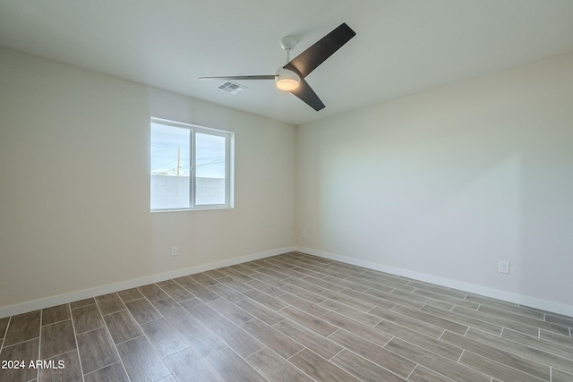 unfurnished room with ceiling fan and light wood-type flooring