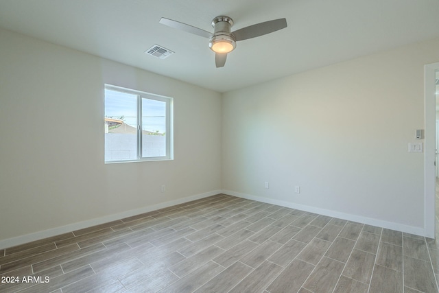 unfurnished room featuring light hardwood / wood-style floors and ceiling fan