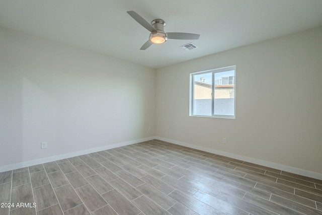 empty room featuring ceiling fan and light wood-type flooring