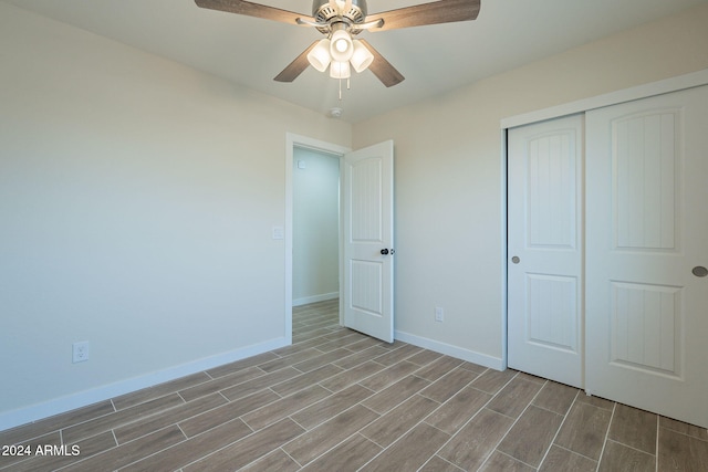 unfurnished bedroom featuring ceiling fan, a closet, and light hardwood / wood-style flooring