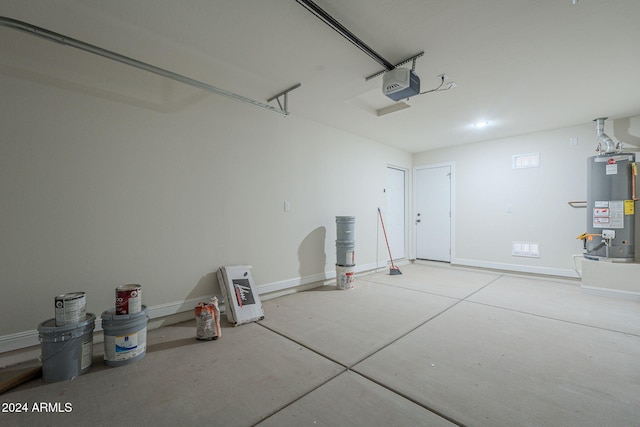 garage with a garage door opener and water heater