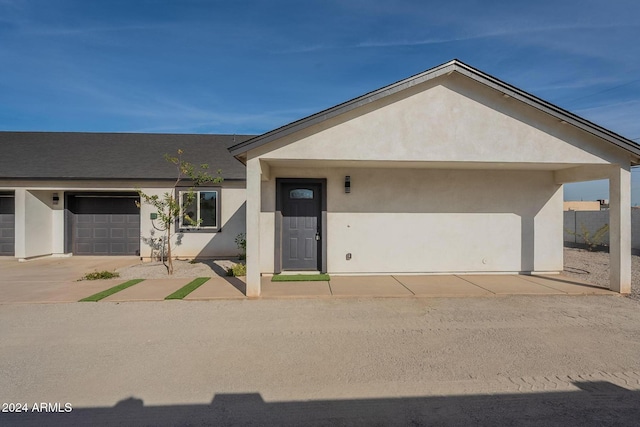 single story home featuring a garage