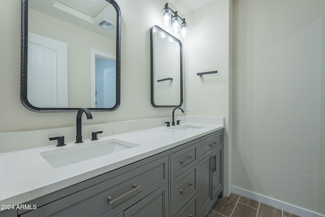 bathroom with vanity and hardwood / wood-style flooring