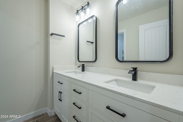 bathroom featuring vanity and wood-type flooring