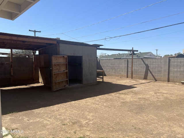 view of outdoor structure with fence