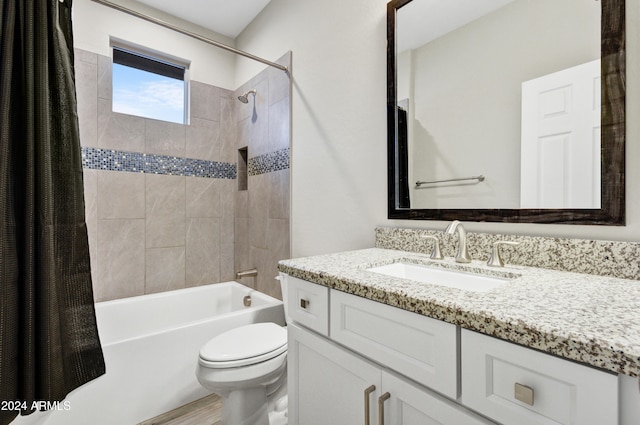 full bathroom featuring shower / bathtub combination with curtain, vanity, and toilet