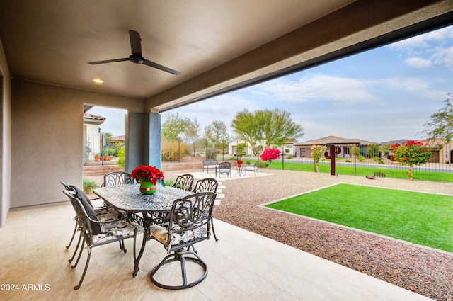 view of patio featuring a playground and ceiling fan