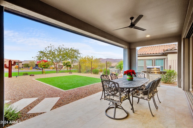 view of patio with ceiling fan