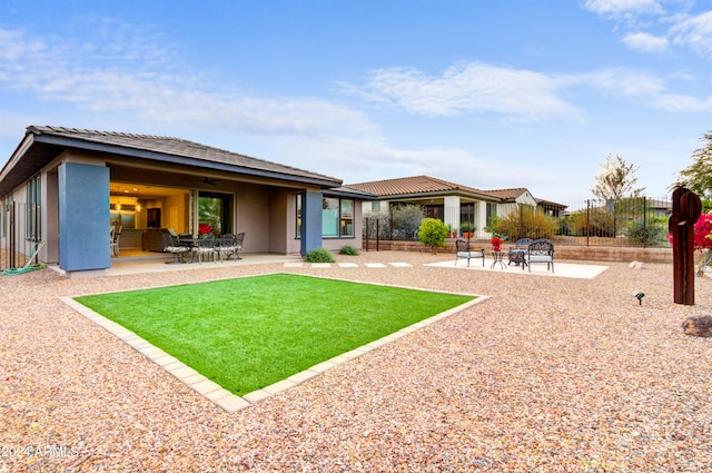 rear view of property featuring a patio