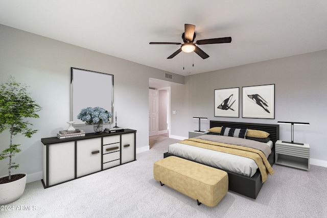 bedroom with ceiling fan and light colored carpet