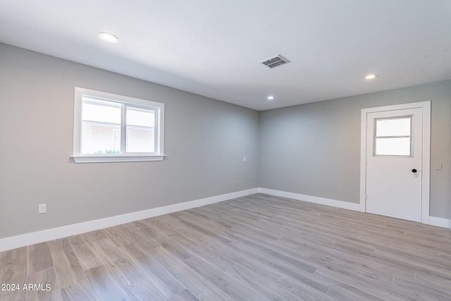 spare room featuring light wood-type flooring