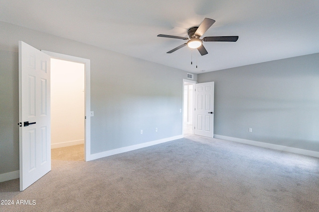 carpeted empty room with ceiling fan