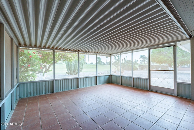 unfurnished sunroom with a wealth of natural light