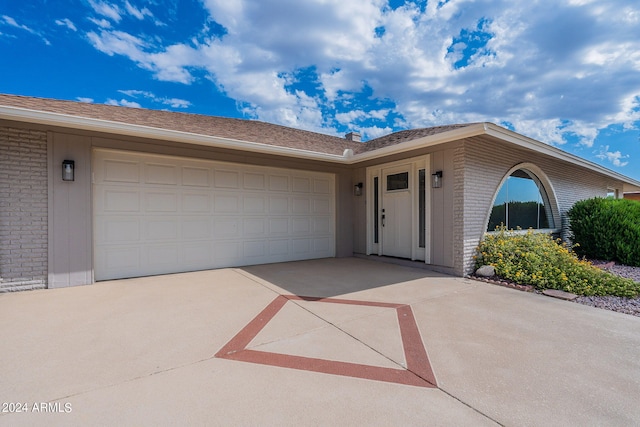 single story home featuring a garage