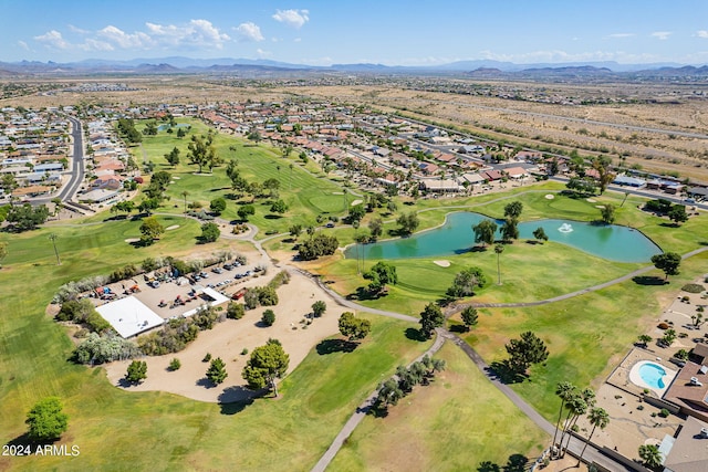 birds eye view of property with a water and mountain view