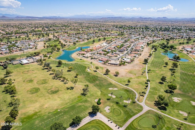 drone / aerial view with a water and mountain view