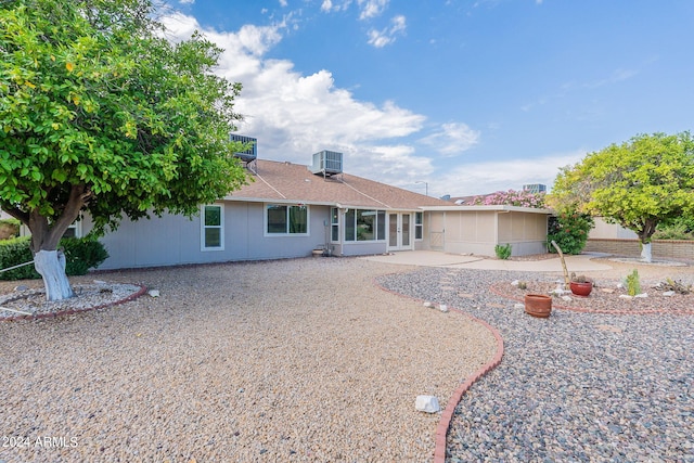 single story home with a patio area and central air condition unit