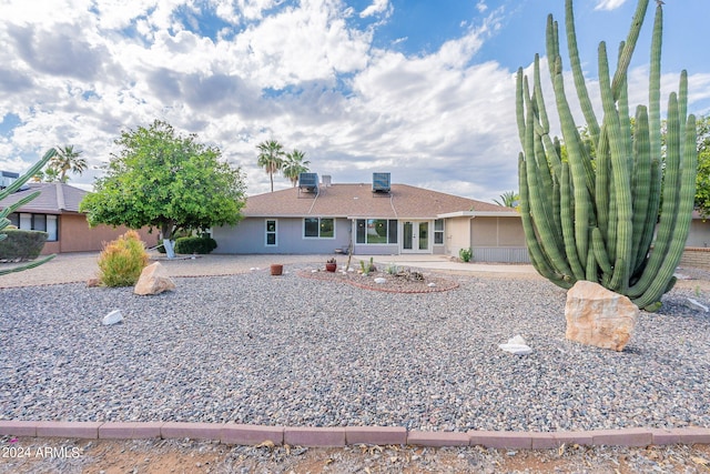 ranch-style house with central air condition unit