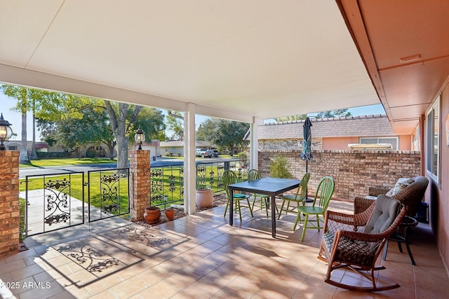 view of patio featuring a balcony