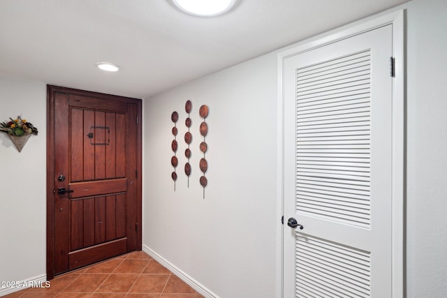 doorway featuring light tile patterned floors