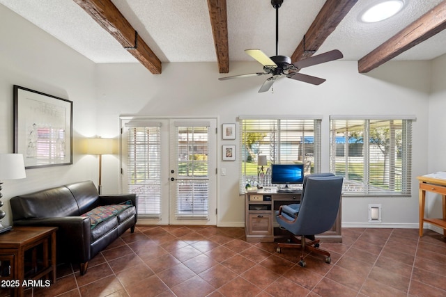 office space with ceiling fan, a textured ceiling, dark tile patterned flooring, french doors, and beamed ceiling