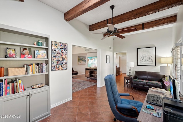 office space featuring built in shelves, ceiling fan, beam ceiling, and tile patterned flooring