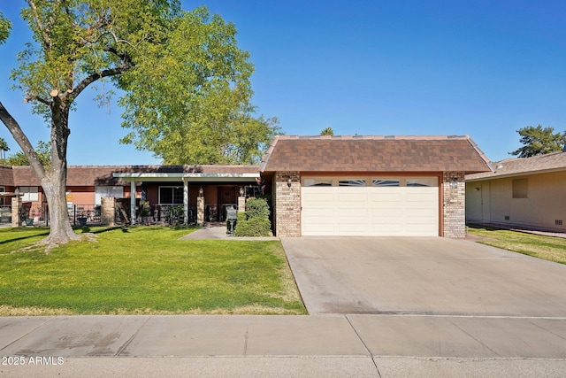 ranch-style home with a garage and a front yard