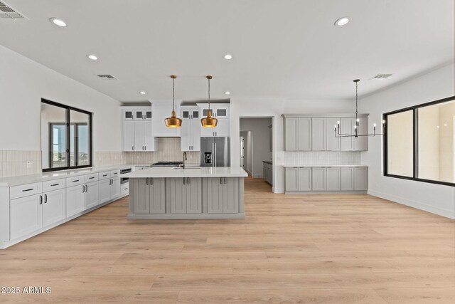 34256 S State Route 89th Hwy, Wickenburg, AZ 85390 - kitchen featuring stainless steel refrigerator with ice dispenser, light countertops, backsplash, recessed lighting, and light wood-style flooring