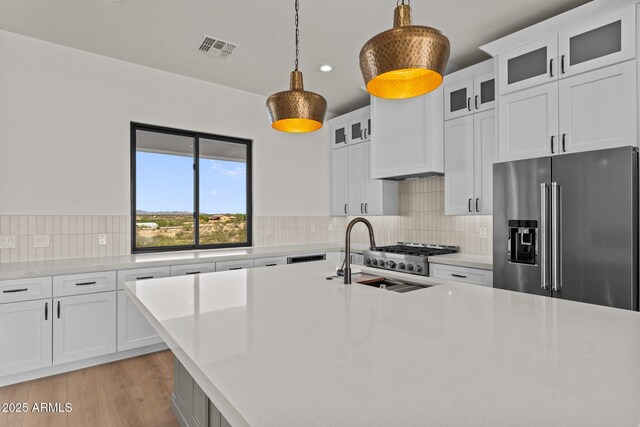 34256 S State Route 89th Hwy, Wickenburg, AZ 85390 - kitchen featuring high end refrigerator, a sink, light countertops, and recessed lighting