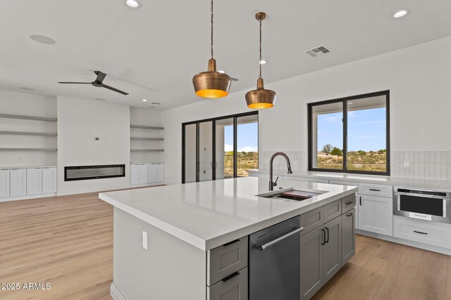 34256 S State Route 89th Hwy, Wickenburg, AZ 85390 - kitchen featuring a sink, appliances with stainless steel finishes, gray cabinets, plenty of natural light, and recessed lighting