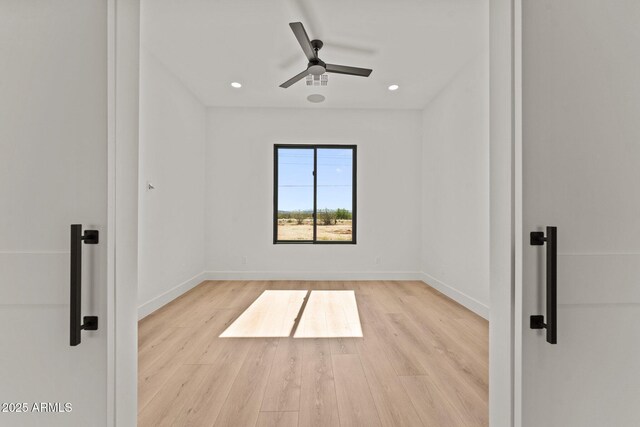 34256 S State Route 89th Hwy, Wickenburg, AZ 85390 - spare room with wood finished floors, ceiling fan, baseboards, and recessed lighting