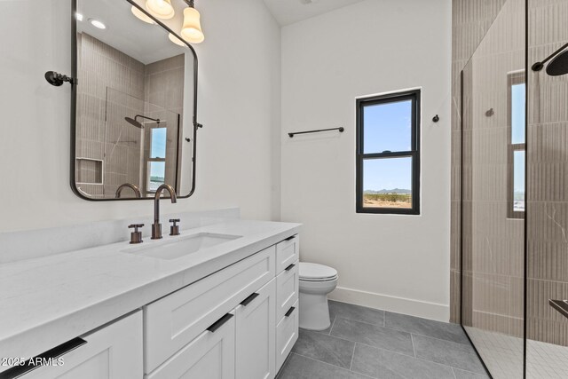 34256 S State Route 89th Hwy, Wickenburg, AZ 85390 - full bathroom featuring tiled shower, vanity, toilet, tile patterned floors, and baseboards