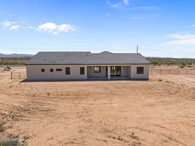34256 S State Route 89th Hwy, Wickenburg, AZ 85390 - back of house with a patio area, a tile roof, and a mountain view